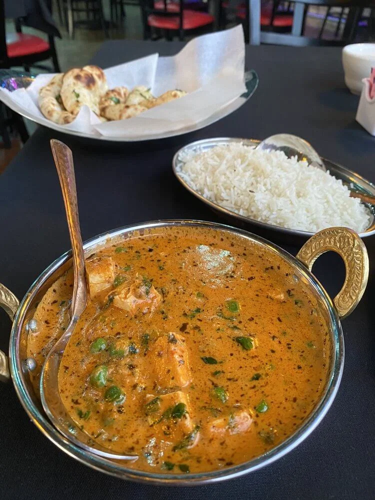 Empyrean Indian Kitchen signature dishes Butter ChickenChicken Tikka MasalaPaneer Kaju Makhani
